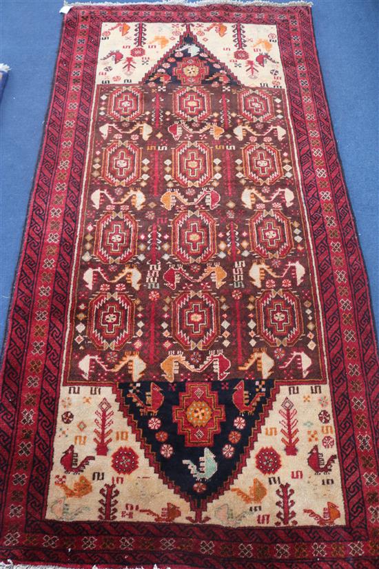A Persian Kazak red ground rug, 200 x 100cm